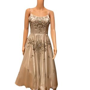 Beautifully beaded, tea length, crinoline(ish) gown.